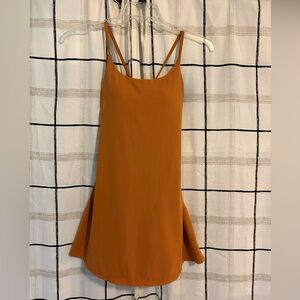 Size medium athletic dress with bodysuit underneath.